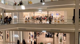People shopping at Zara, a fashion brand having a pre-Black Friday 2022 sale.