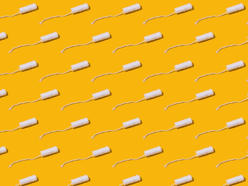Cellulose white tampon pattern with twine on yellow background. Concept of menstruation, ovulation, ...