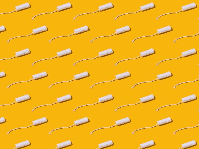 Cellulose white tampon pattern with twine on yellow background. Concept of menstruation, ovulation, ...