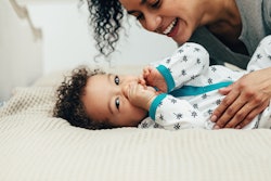 a mom and baby snuggling in an article about baby names that start with I
