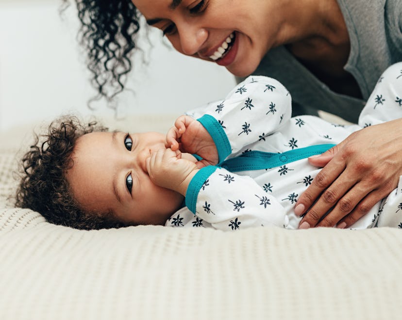 a mom and baby snuggling in an article about baby names that start with I