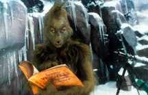 Jim Carrey looking through phone directory in a scene from the film 'How The Grinch Stole Christmas'...