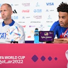 USA's midfielder Tyler Adams (R) and coach Gregg Berhalter give a press conference at the Qatar Nati...