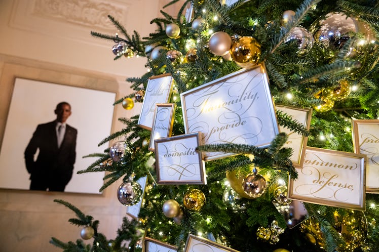 Decorations are seen near a portrait of former President Barack Obama during the media preview of th...