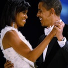 President Barack Obama dances with his wife and First Lady Michelle Obama during the Western Inaugur...