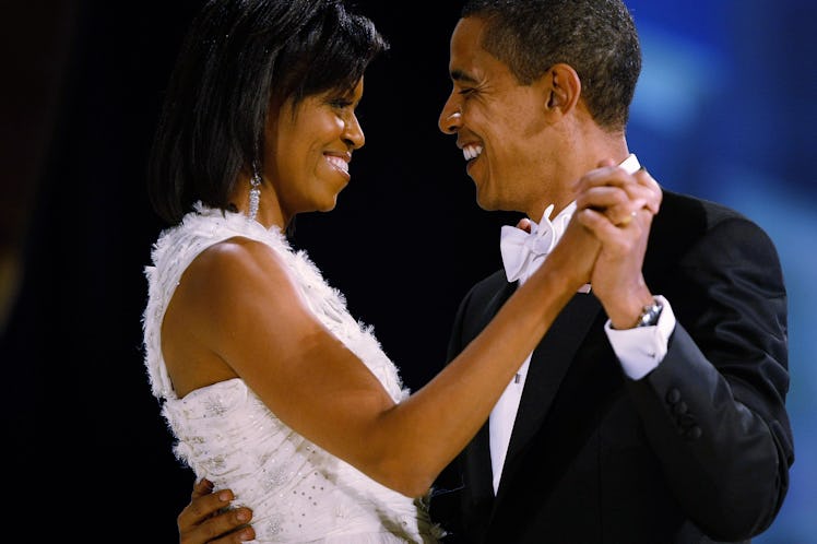 President Barack Obama dances with his wife and First Lady Michelle Obama during the Western Inaugur...