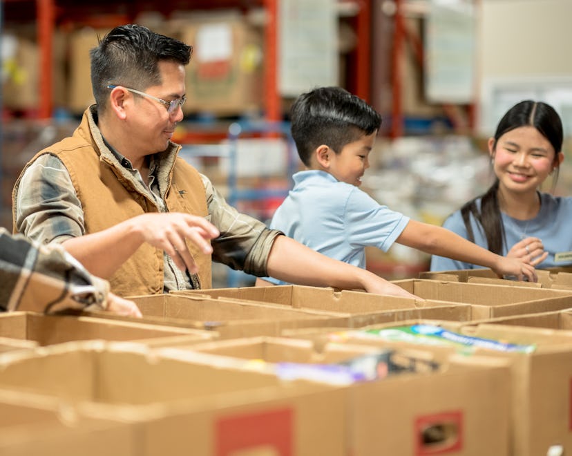 Giving Tuesday 2022 is meant to encourage donating and volunteering, like this family of four sortin...