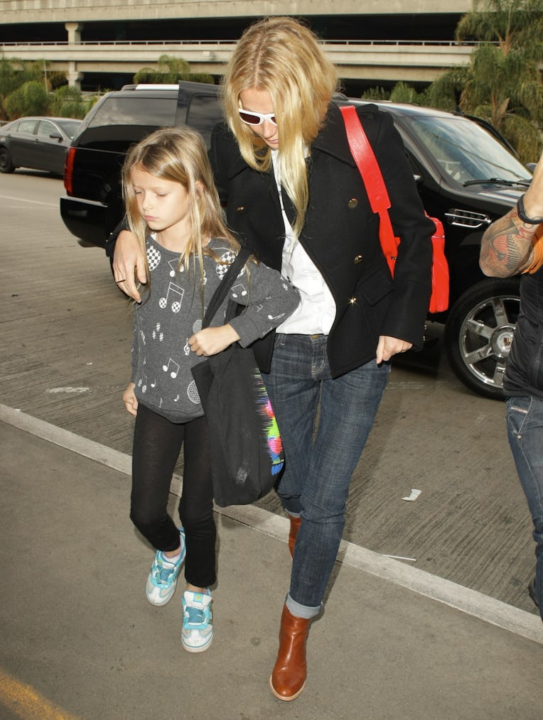 LOS ANGELES, CA - DECEMBER 18:  Gwyneth Paltrow (R) and Apple Martin are seen at LAX airport on Dece...