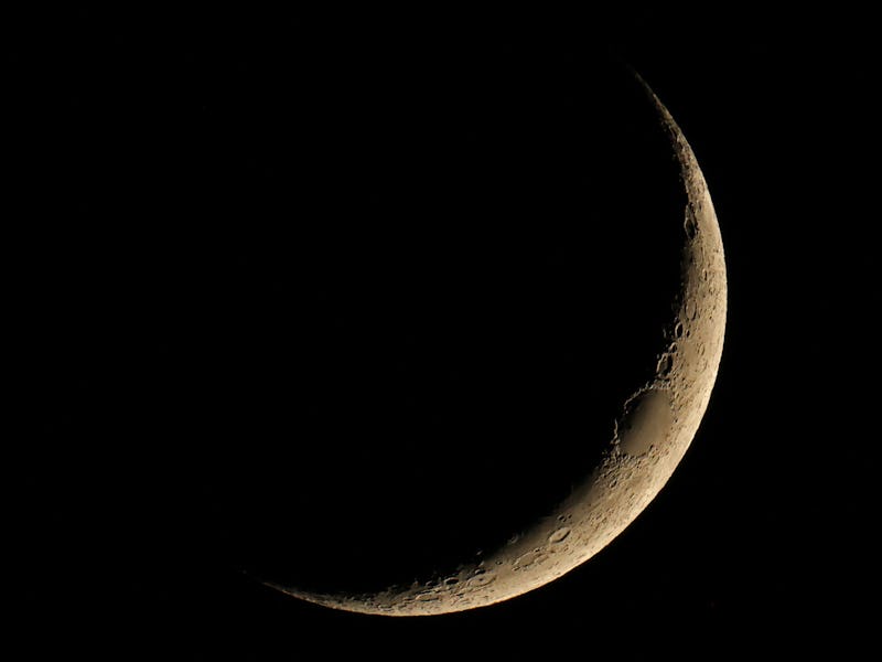 TOPSHOT - This photograph shows the crescent moon from Malaga on November 26, 2022. (Photo by Thomas...