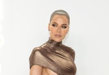Khloe Kardashian wore long, mermaid waves on Instagram in November 2022. Her hair color was giving a...