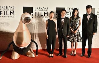Takashi Yamazaki (R), Japanese director of "Parasyte," and actress Ai Hashimoto (2R), actor shota So...