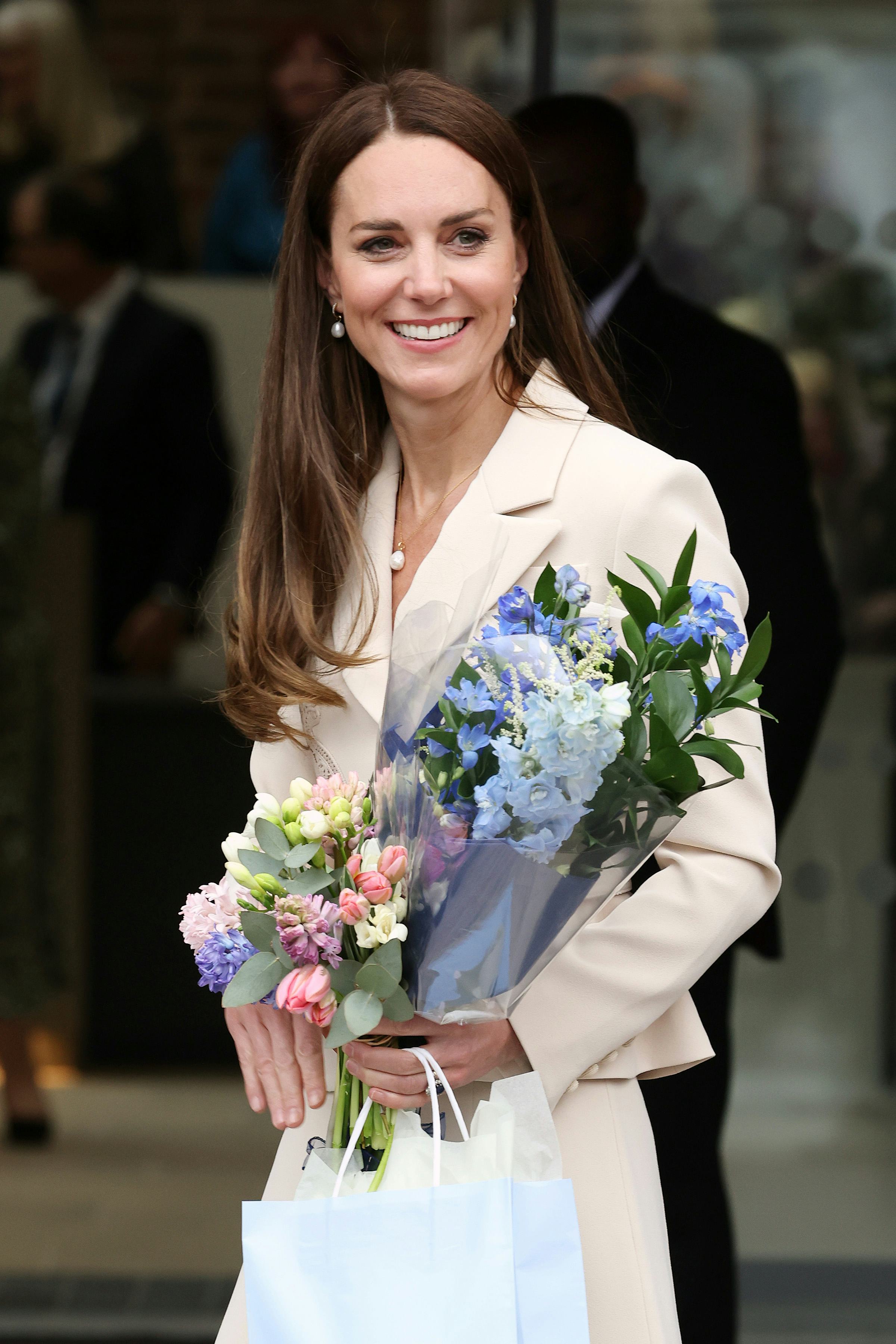 Kate Middleton wearing a beige midi dress from Self-Portrait.