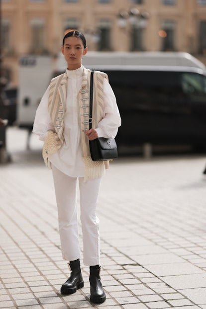 pfw guest in white jeans and black boots