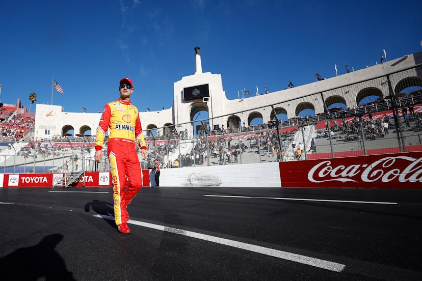 LOS ANGELES, CALIFORNIA - FEBRUARY 06: Joey Logano, driver of the #22 Shell Pennzoil Ford, walks the...