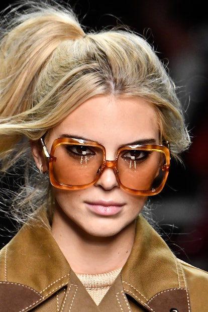 Kendall Jenner Beauty Evolution: Kendall Jenner, with blond hair, walks the runway at the Fendi Read...
