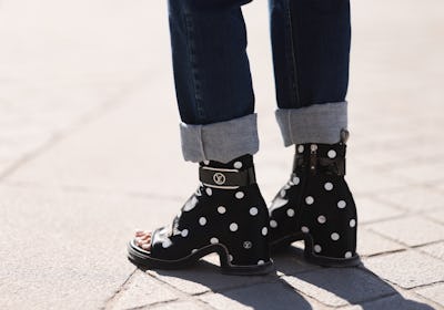  A fashion week guest seen wearing polka dots boots by Louis Vuitton
