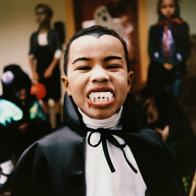 child dressed in vampire costume to represent old wives tale about christmas eve babies