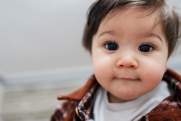 baby boy, looking at camera, portrait in article about boy names that start with N 