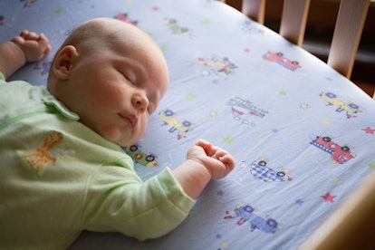 baby sleeping in a crib modeling safe sleep in an article about when is baby too big for the bassine...