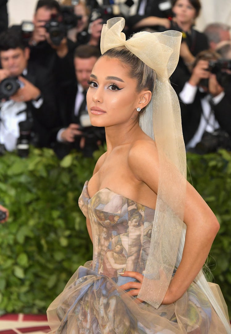 Ariana Grande's beauty evolution includes Ariana Grande's Met Gala hair bow as seen when Ariana Gran...