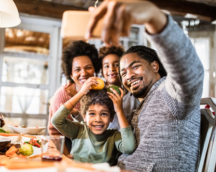 A family having fun while taking a selfie during Thanksgiving in a round up of Thanksgiving text me...