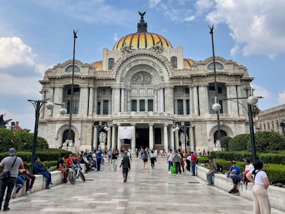 People visit the surroundings of the Palacio de Bellas Artes in Mexico City, which is one of the 202...
