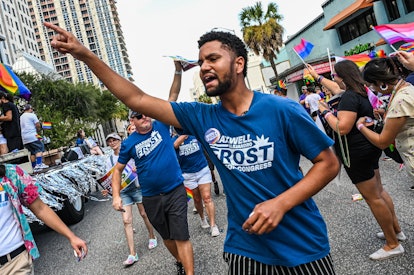 Maxwell Alejandro Frost, who's running for Congress, walks in a Florida pride parade.