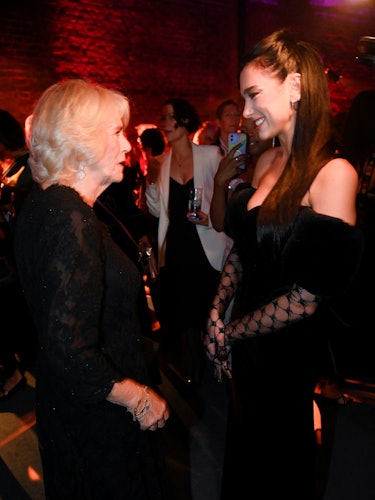 LONDON, ENGLAND - OCTOBER 17: Camilla, Queen Consort meets singer Dua Lipa at the 2022 Booker Prize ...