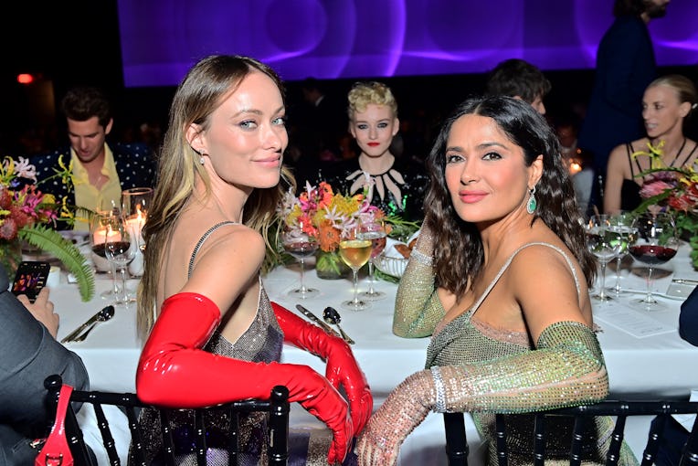 LOS ANGELES, CALIFORNIA - NOVEMBER 05: (L-R) Olivia Wilde, Julia Garner, and Salma Hayek, all wearin...