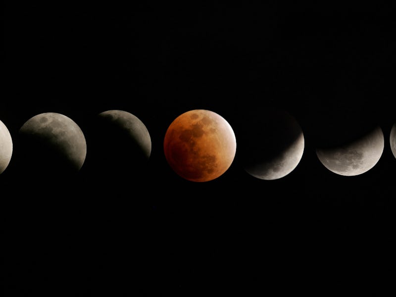 TOPSHOT - The moon enters and emerges from the earth's shadow during a total eclipse of the moon on ...