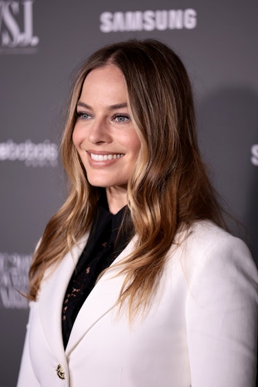 Margot Robbie, with sunny highlights, the 2022 winter hair trend for Capricorn, attends the WSJ. Mag...