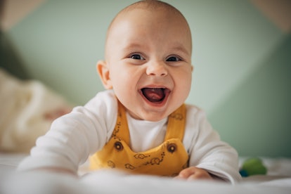 a baby doing tummy time in an article about when to start tummy time.