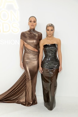 Khloé Kardashian and Kim Kardashian attend the CFDA Fashion Awards 