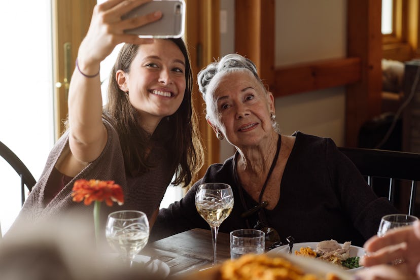  snapping a photo at thanksgiving dinner in a round up of thanksgiving instagram captions