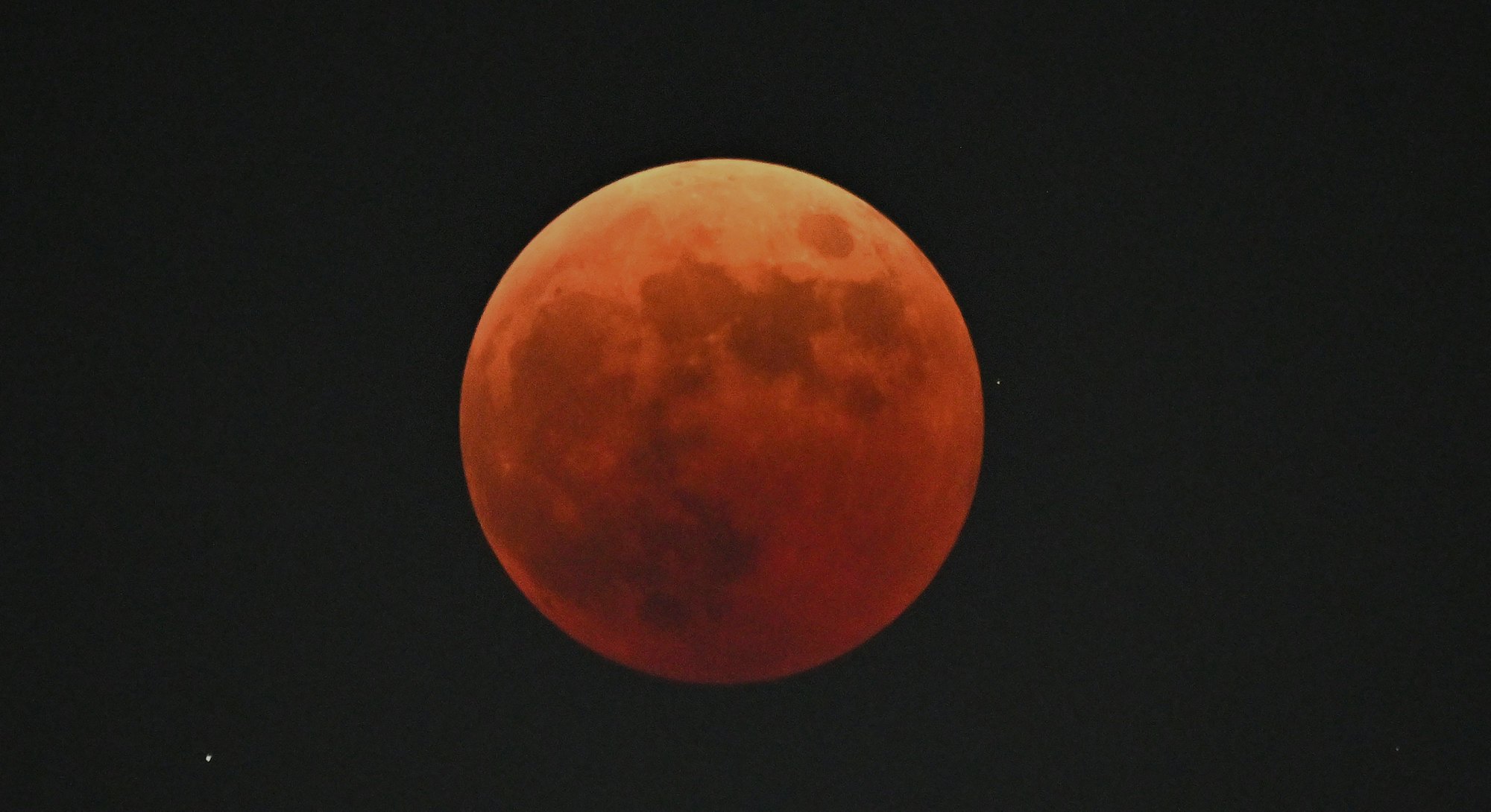 The blood moon is seen during a total lunar eclipse in Goyang, northwest of Seoul, on November 8, 20...
