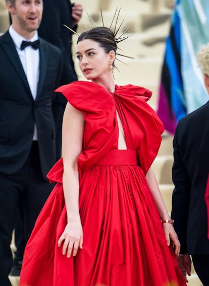 Anne Hathaway is seen arriving to the Heavenly Bodies: Fashion & The Catholic Imagination Costume In...