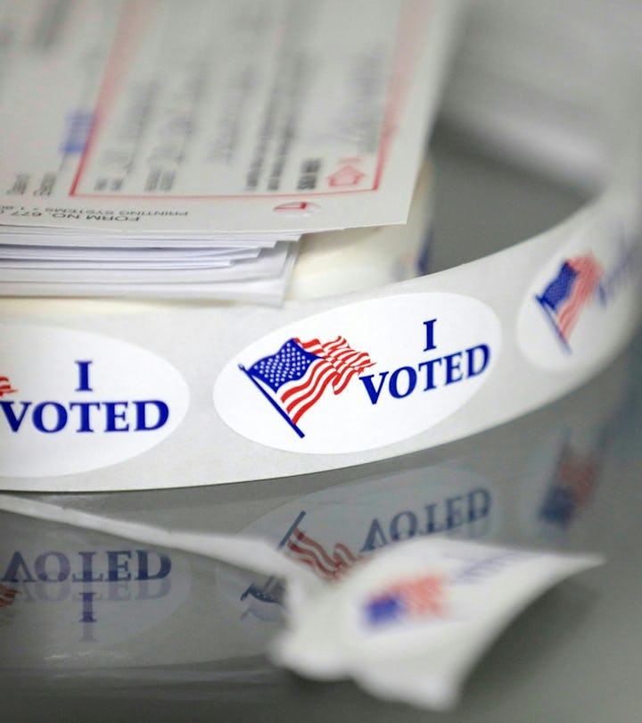 "I voted" stickers are displayed at a poll station at Wolverine Lake, Michigan, on November 8, 2022....