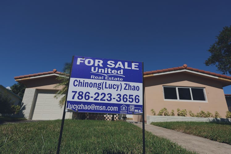HOLLYWOOD, FLORIDA - OCTOBER 27: A 'For Sale' sign is posted in front of a single family home on Oc...