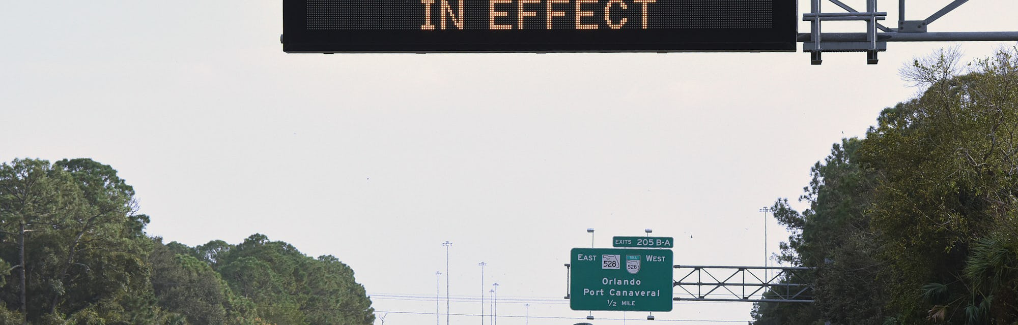 COCOA, FLORIDA, UNITED STATES - 2022/11/08: A road sign on I-95 in Cocoa, Florida, advises travelers...