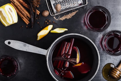 Pot and glasses of mulled wine a mulled wine Instagram caption. 