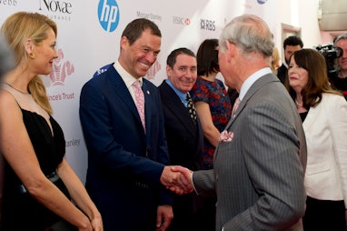 LONDON, ENGLAND - MARCH 12:  (L-R) Tess Daly looks on as Dominic West meets Prince Charles, Prince o...