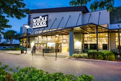 Exterior of a Whole Foods market at dusk, illustrating Whole Foods Thanksgiving 2022 hours.