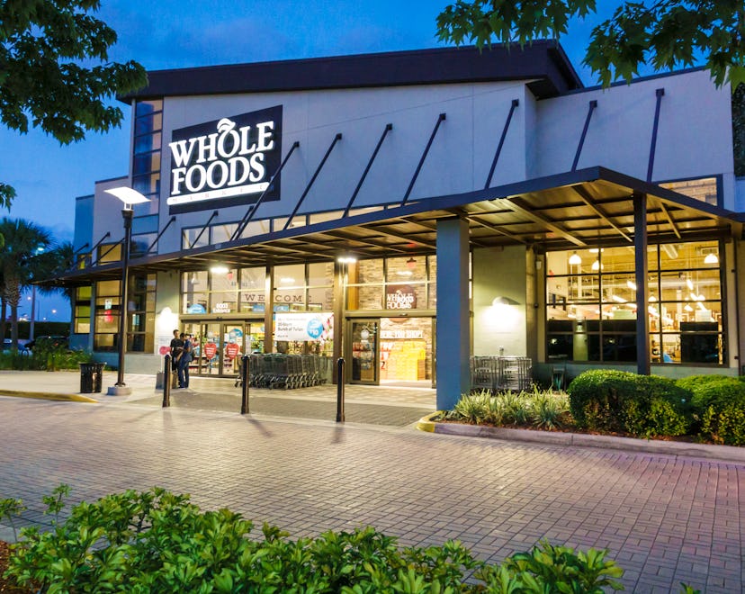 Exterior of a Whole Foods market at dusk, illustrating Whole Foods Thanksgiving 2022 hours.