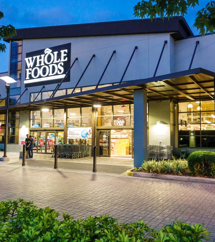 Exterior of a Whole Foods market at dusk, illustrating Whole Foods Thanksgiving 2022 hours.