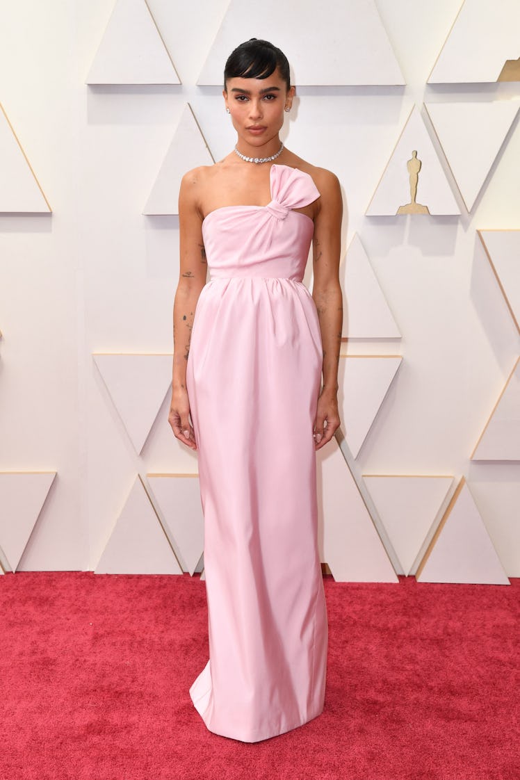 Zoe Kravitz at the 94th Oscars' red carpet in a light pink, floor-length, strapless gown 