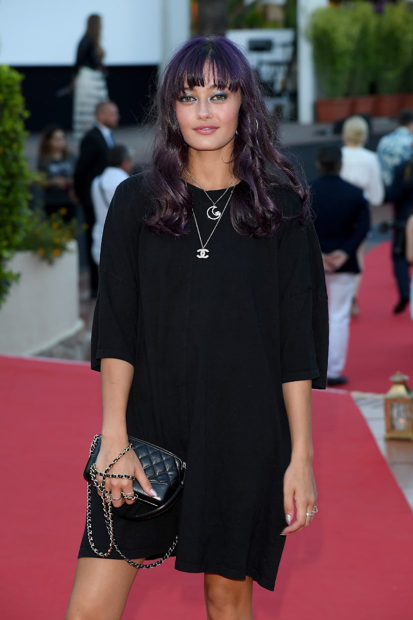 Ella Purnell with violet-inspired brunette hair.