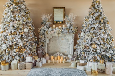 Gold and white Christmas trees in a living room are the trendy way to go this holiday season, accord...