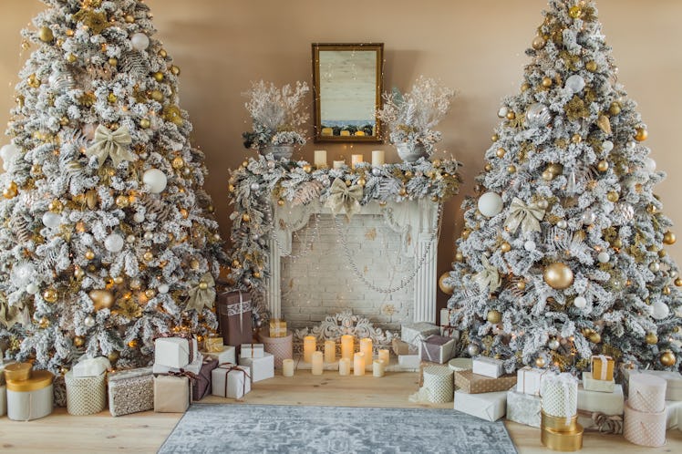Gold and white Christmas trees in a living room are the trendy way to go this holiday season, accord...