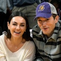Mila Kunis and Ashton Kutcher attend a basketball between the Los Angeles Lakers and the Brooklyn Ne...
