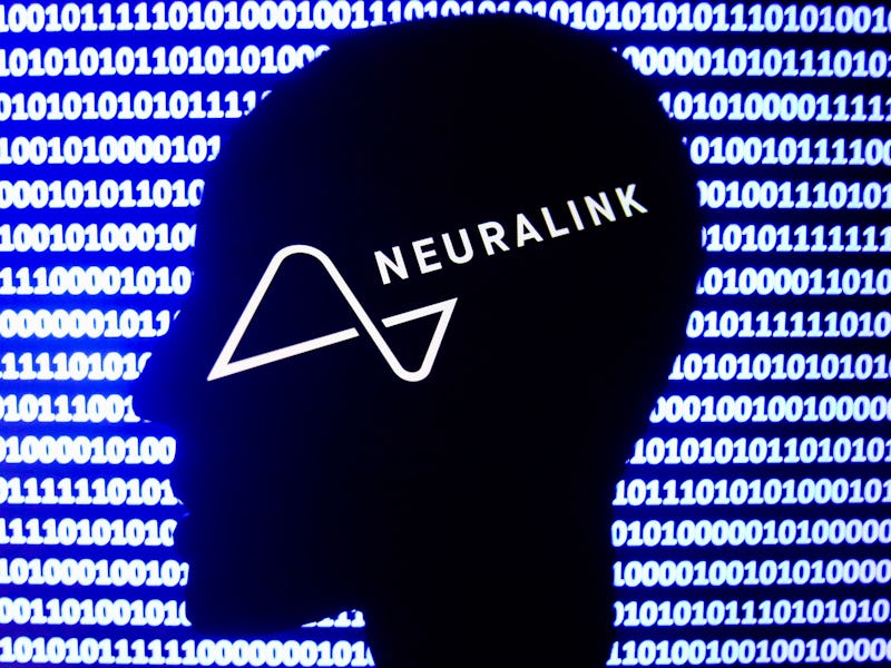 Neuralink logo displayed on a phone screen, a silhouette of a paper in shape of a human face and a b...